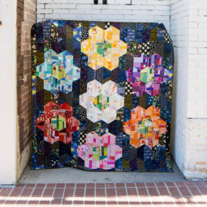 Giant Scrappy Grandmother Garden quilt.