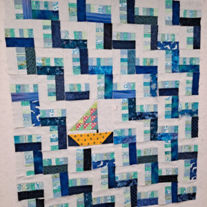 Scrappy rail fence quilt with focus sailboat block 
