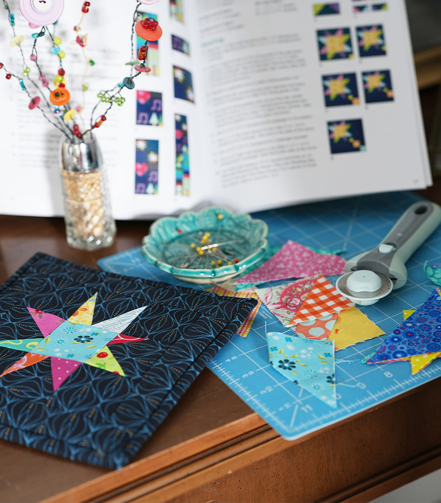 Scrappy quilting project on a cutting mat