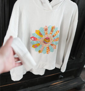 Upcycled sweatshirt with appliqued Dresden