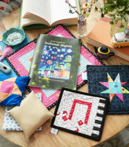 Pattern booklet and small sewing projects on a table.
