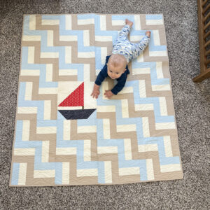 baby on a rail fence quilt with sailboat accent 