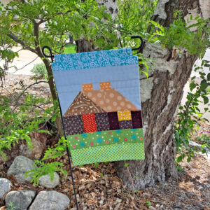 Log cabin garden flag outside