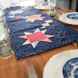 Star table runner on set table