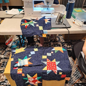star blocks become quilt rows with sewing machine