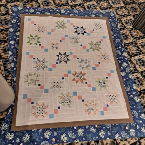 Pastel stars quilt with white background