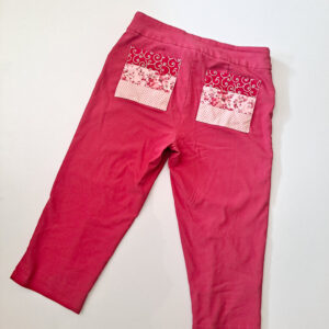 Upcycled red pants with patchwork pockets