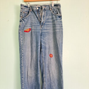Jeans with visible mending