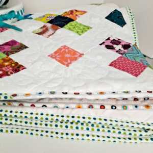Folded plus quilt put on point with scrappy binding
