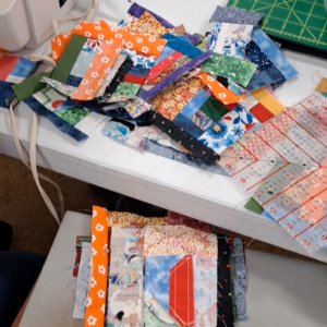 Growing pile of crumb quilt blocks