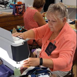 quilter sewing at machine