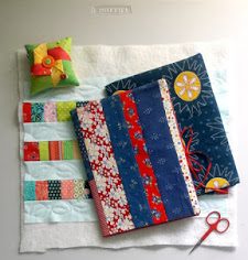 two quilted journal covers with one in process.
