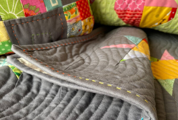 a collection of quilts with big stitch quilting