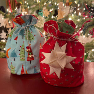 drawstring gift bags by Christmas tree