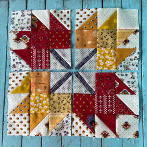 Four maple leaf quilt blocks