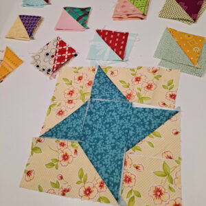 Half square triangles with a friendship star quilt block