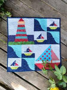 Sailboat and lighthouse wall hanging