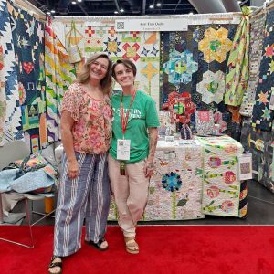 Aunt Em and Tori from Stitchin' Heaven enjoying international Quilt Market.