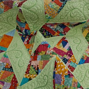 Crumb quilt with feather quilting