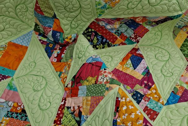 Crumb quilt with feather quilting