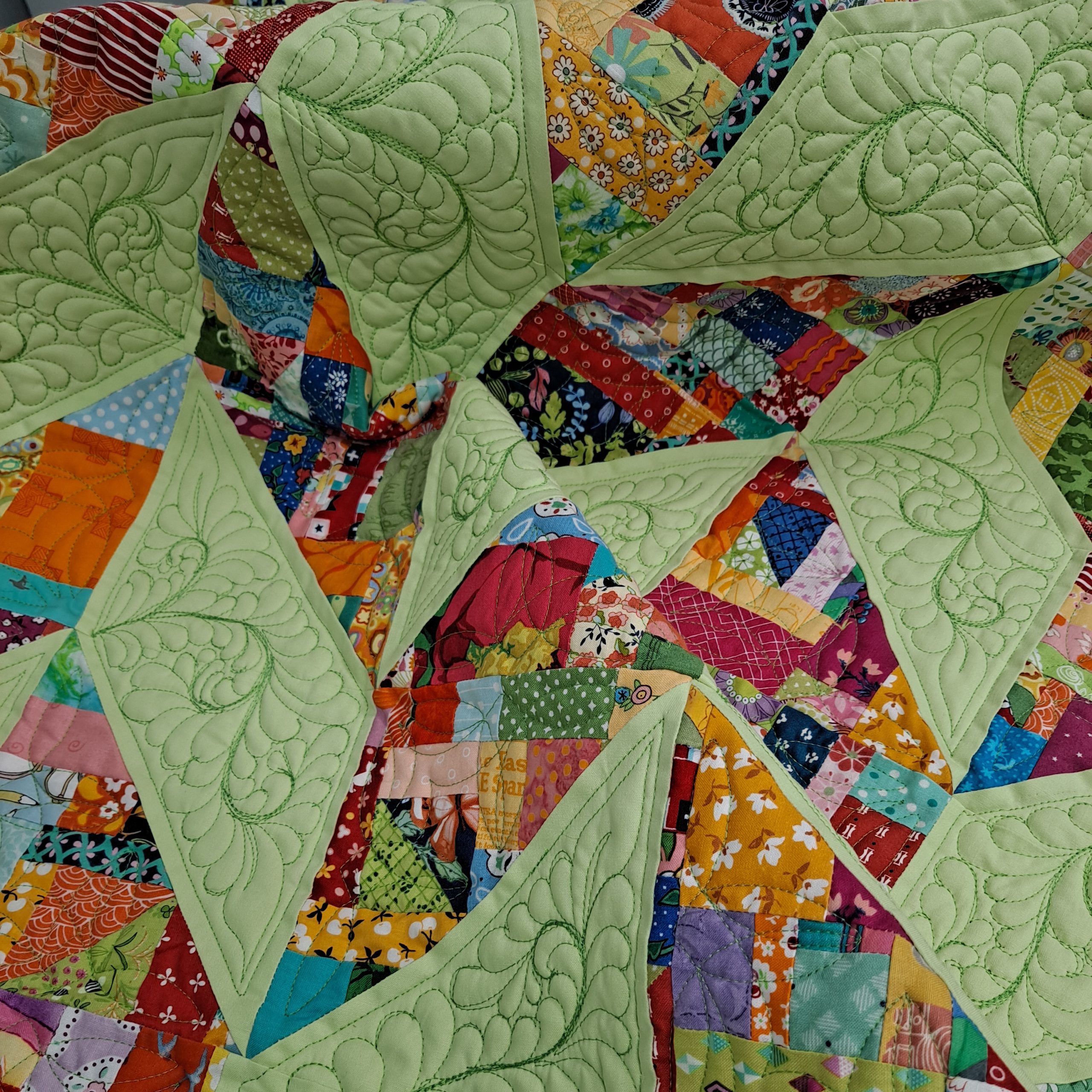 Crumb quilt with feather quilting