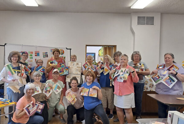 Quilters showing off their crumb quilt blocks