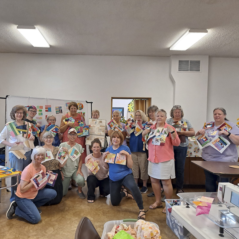 Quilters showing off their crumb quilt blocks