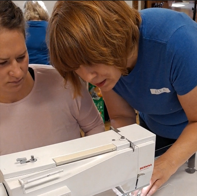 Experienced quilter helping a beginner
