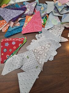 half square triangle pieces cut from scrap fabric
